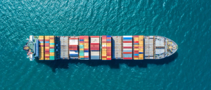 cargo ship travelling between trade ports