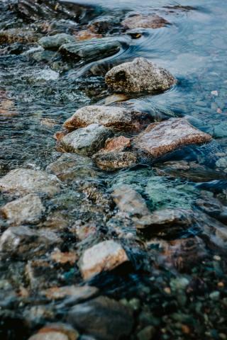A shallow river running over some rocks
