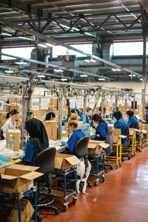 People working in a factory at desks