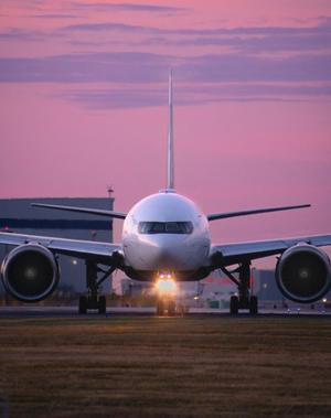 Plane in transit on the runway at an airport