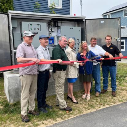 Jeff Grip (Selectman, Town of Hampton), Tom Bassett (Neighborhood Advocate), Bob Scott (NHDES Commissioner), Janet Stevens (NH Executive Councilor), Jen Hale (Hampton Director of Public Works), Joe Lynch (Hampton Deputy Director of Public Works), Bryan Granese (Contractor, N. Granese and Company) at the ribbon cutting standing in front of the new pump system.