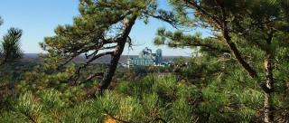 View from the Lantern Hill hiking trail with Foxwoods Resort Casino in Mashantucket, Connecticut seen through the trees