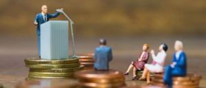 Miniature model people : Businessman speaking on the podium