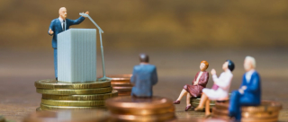 Miniature model people : Businessman speaking on the podium