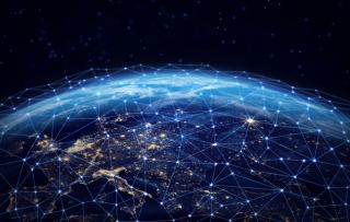 Digital connections around the world. Planet Earth at night with glowing network lines representing global communication, data transfer, and worldwide