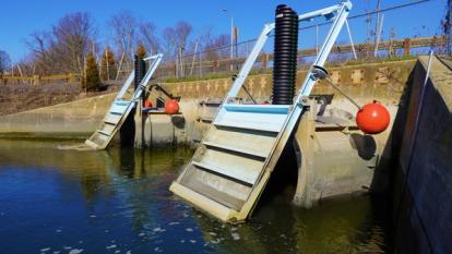 Closer view of the two 6-ft diameter Self-Regulating Tidegates (SRTS) as well as two 6ft by 8.6ft stainless steel flapgates were installed beneath the Captain Thomas Boulevard bridge to regulate flow in the Cove River tidal marsh
