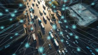 Aerial view of road with lorries and other traffic. There is a digital pattern over the top.