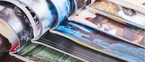 stack of open colorful magazines