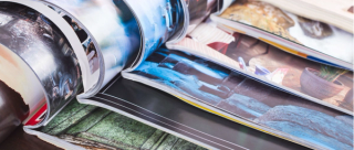 stack of open colorful magazines