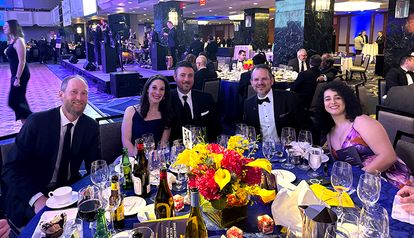 The SLR team sitting at their table enjoying dinner at the ACEC New York Engineering Excellence Awards event