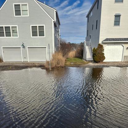 Flooding in Hampton neighborhood on street encroaching on houses