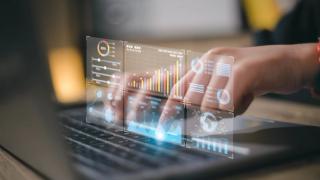 Data analyst working on business analytics dashboard with charts, metrics and KPI to analyze performance and create insight reports for operations