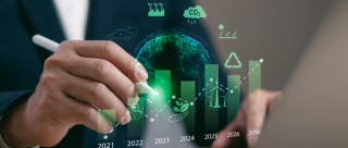 Closeup of businessman using digital pen on a timeline bar chart showing sustainable growth and eco goals from 2021 to 2050. Concept of green strategy, climate action and carbon neutral target
