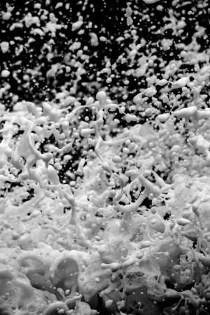 Foam splashing on a black background