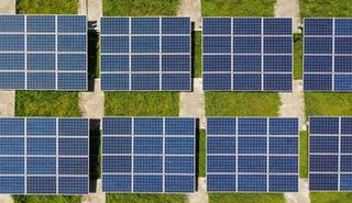 Aerial view of solar panels in a field
