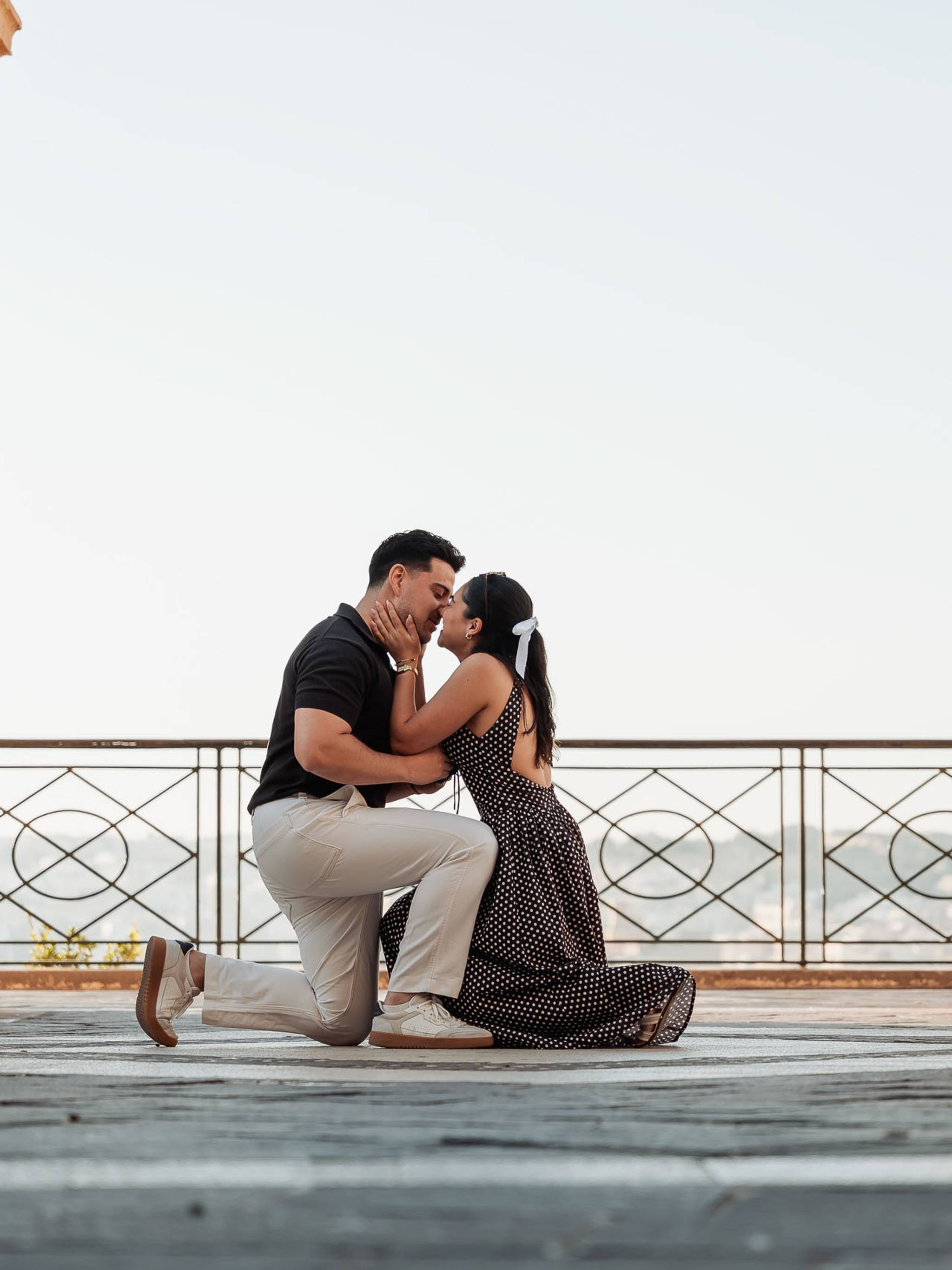 Surprise proposal at Upper Barrakka Gardens in Valletta, Malta, as he gets down on one knee.