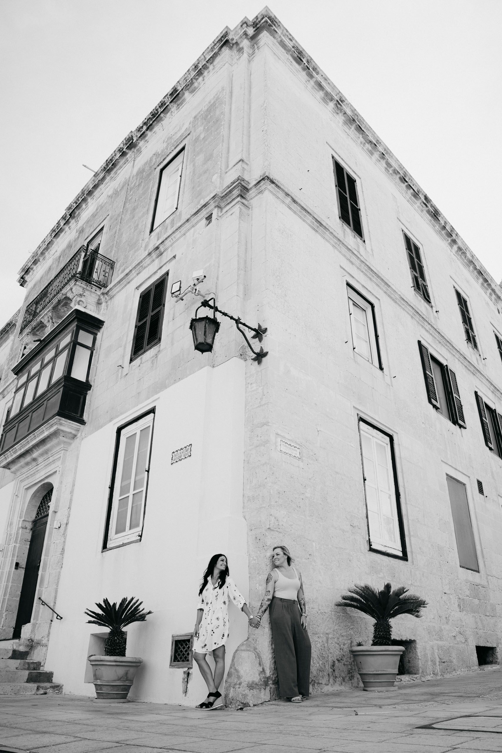 Couple portrait beside traditional Maltese architecture during an Mdina proposal photoshoot