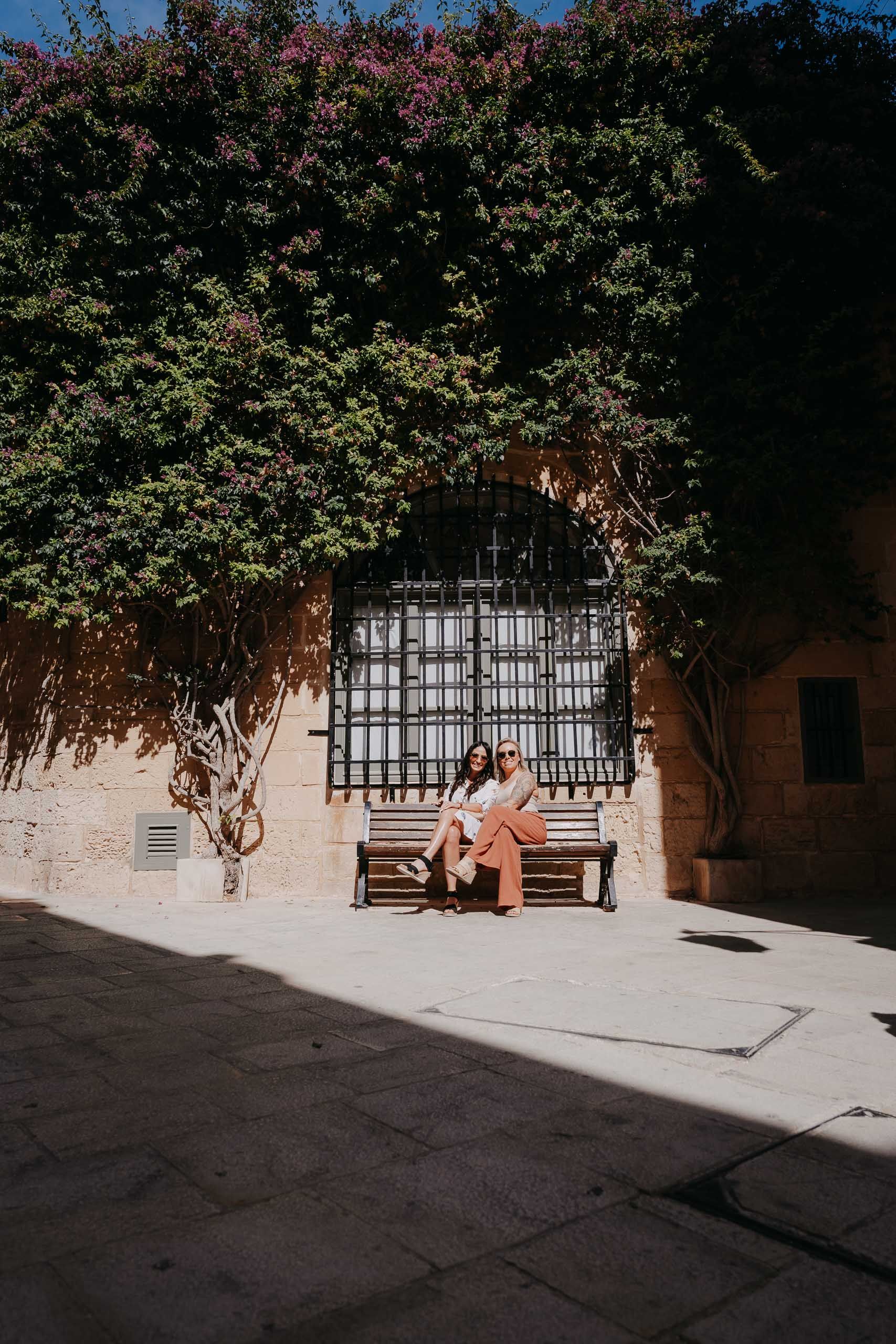 Engaged couple relaxing during a proposal photoshoot in Mdina, Malta