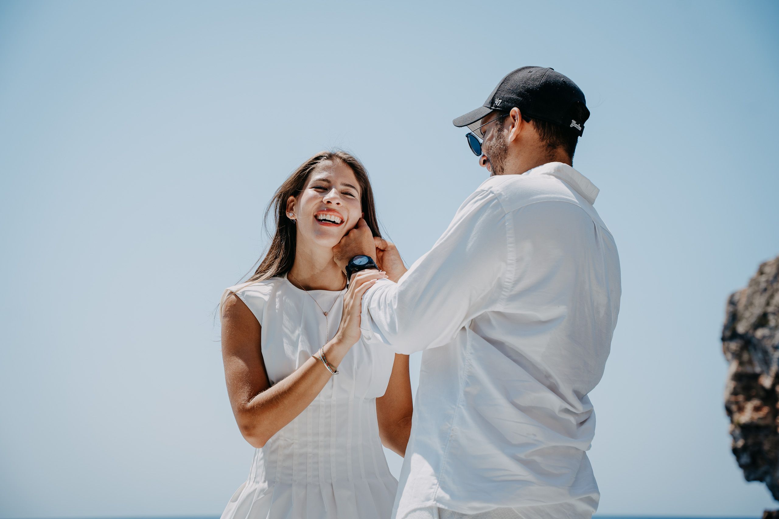 Happy newly engaged couple during a boat proposal photoshoot at Blue Grotto, Malta