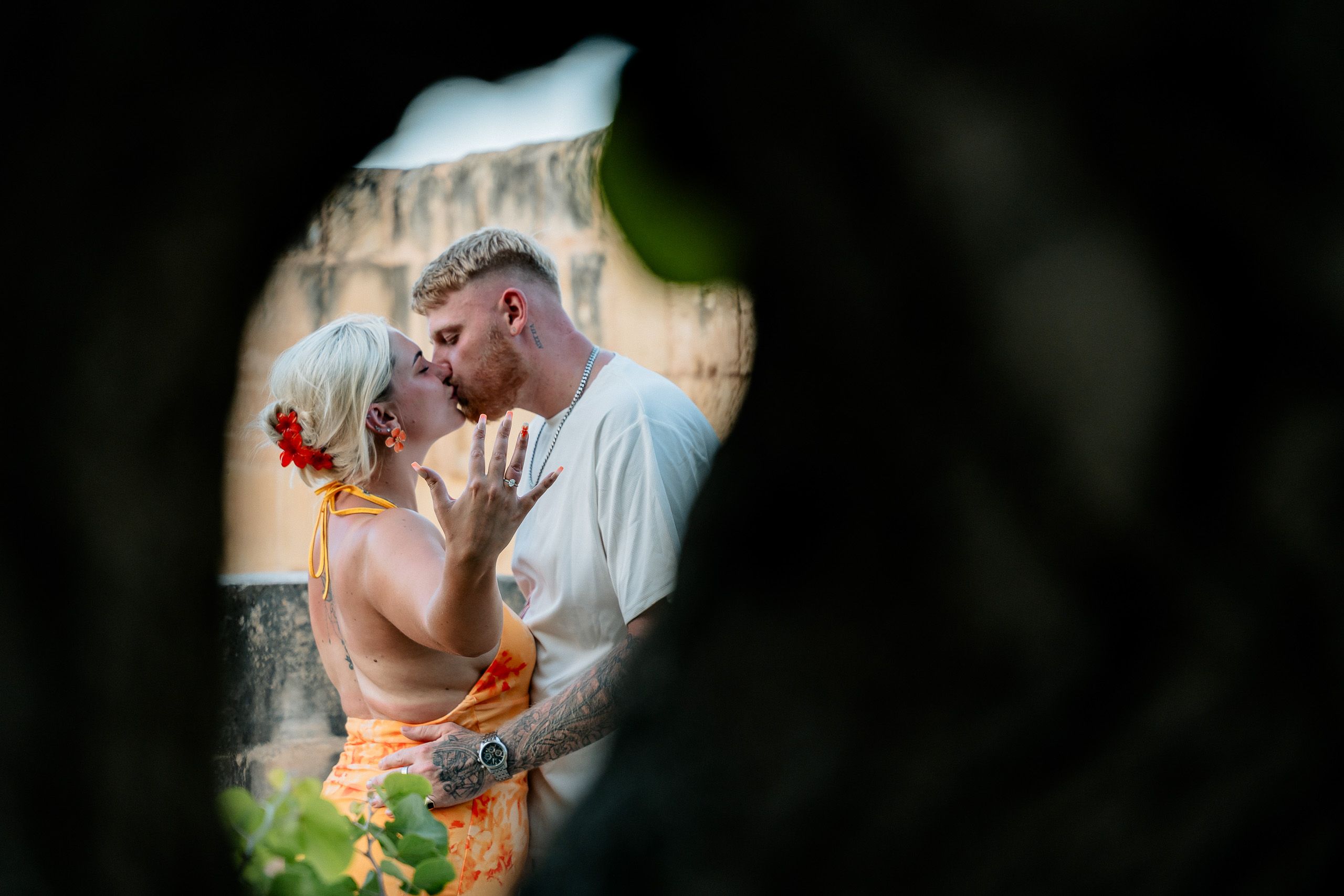 Newly engaged couple kissing with engagement ring after a Birgu proposal in Malta