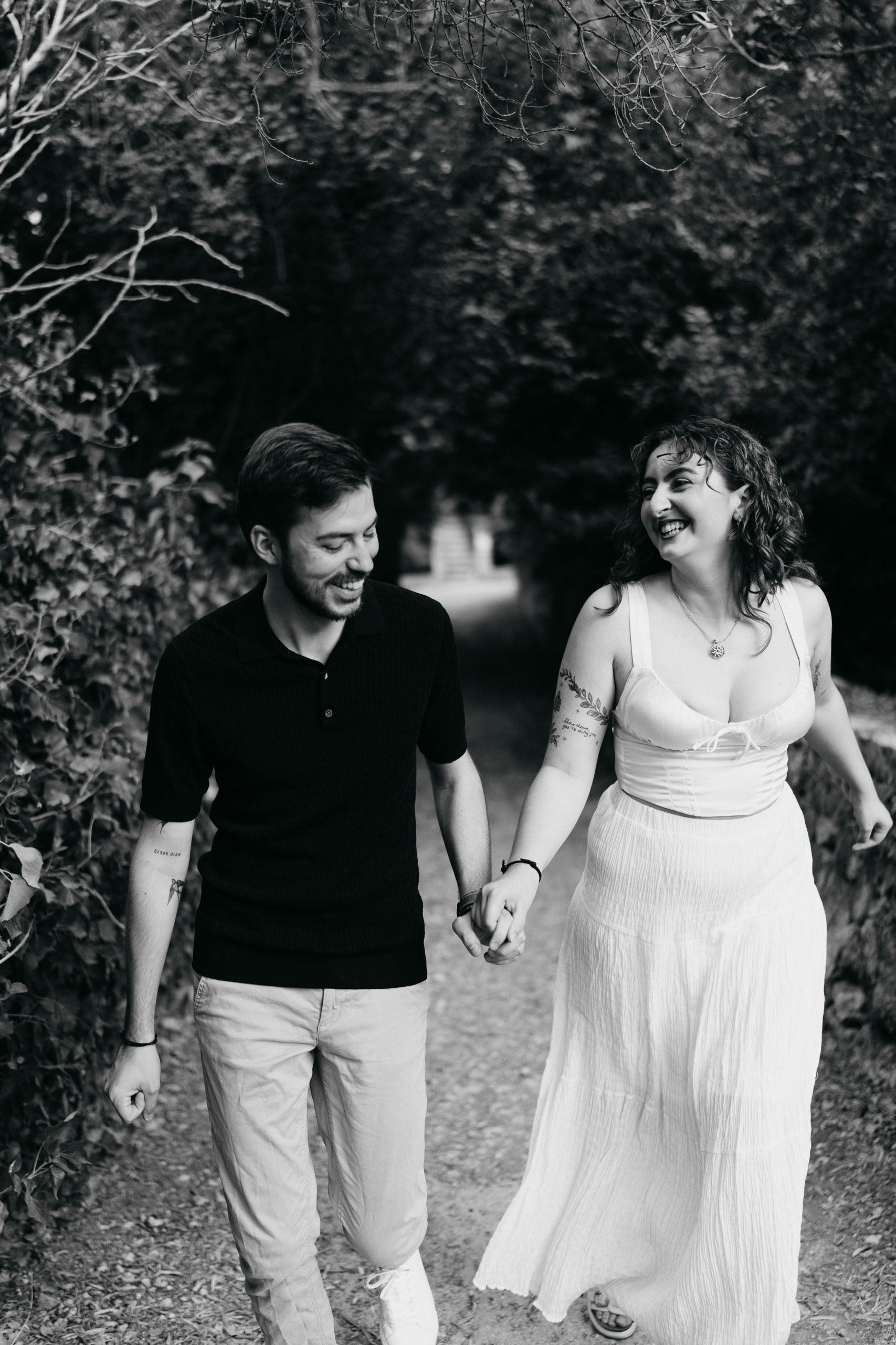 Jay and Cristina laughing together during their pre-wedding shoot at Buskett Woodlands in Rabat, Malta.