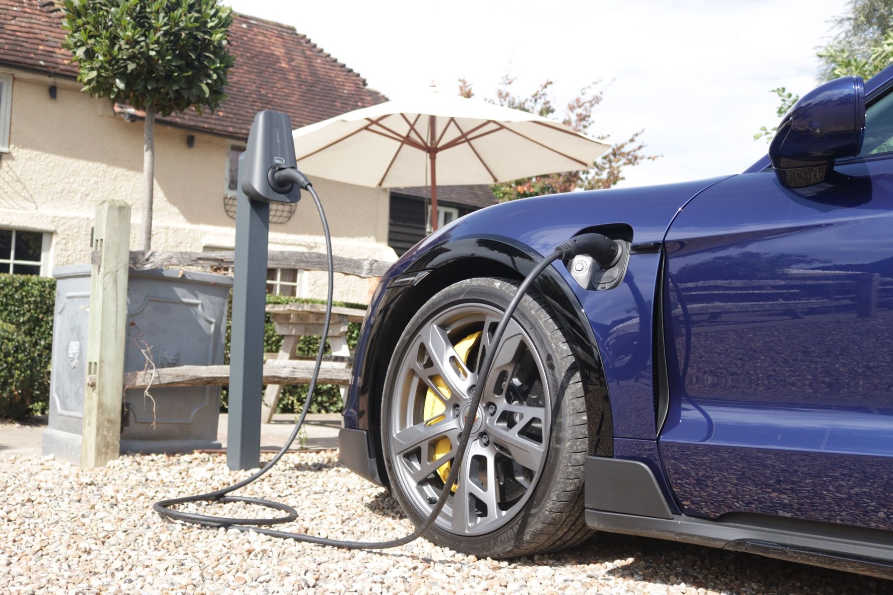 A car plugged into a post-mounted Brim charger