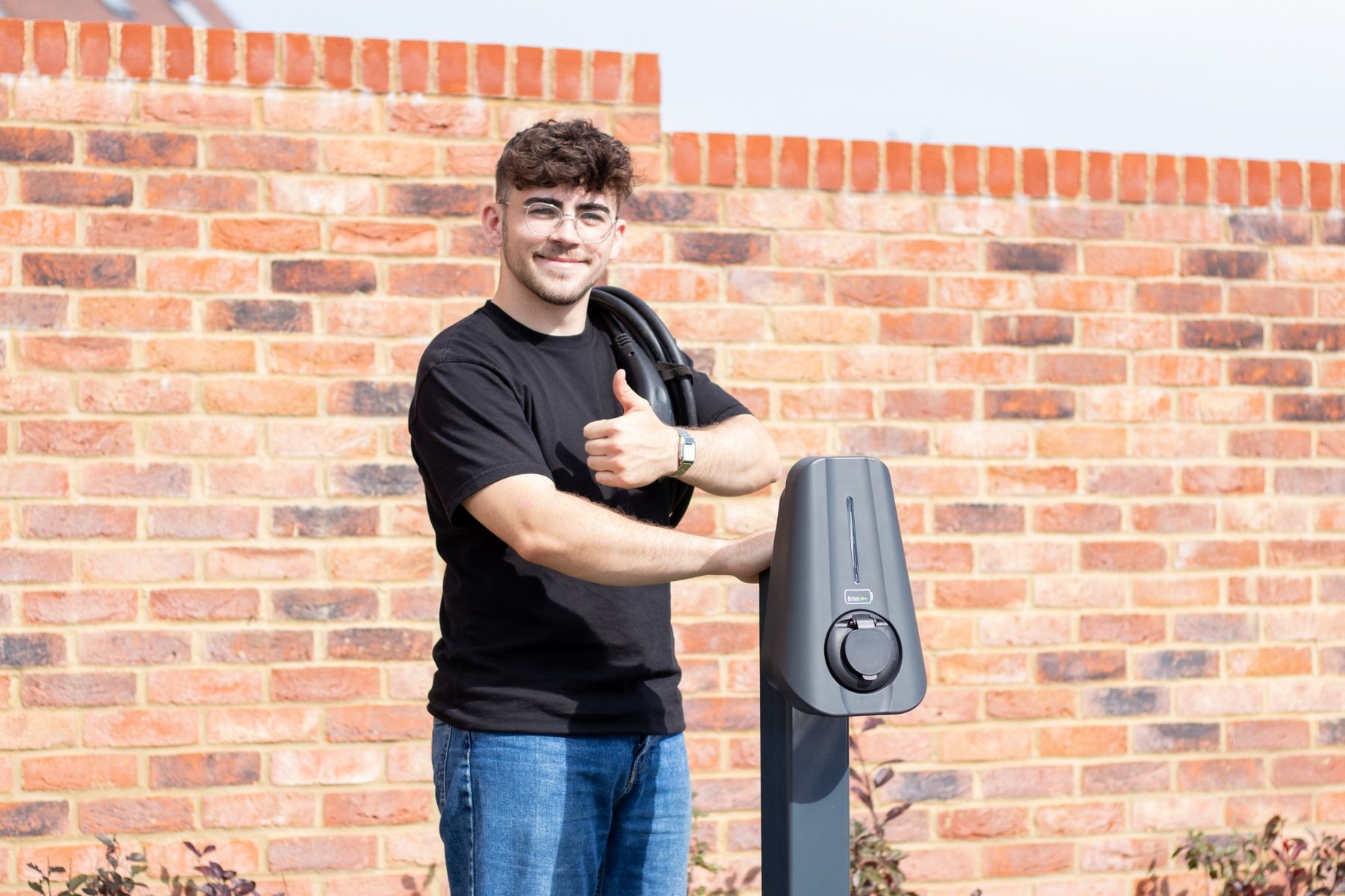 A Brim charger on a post in a residents' car park