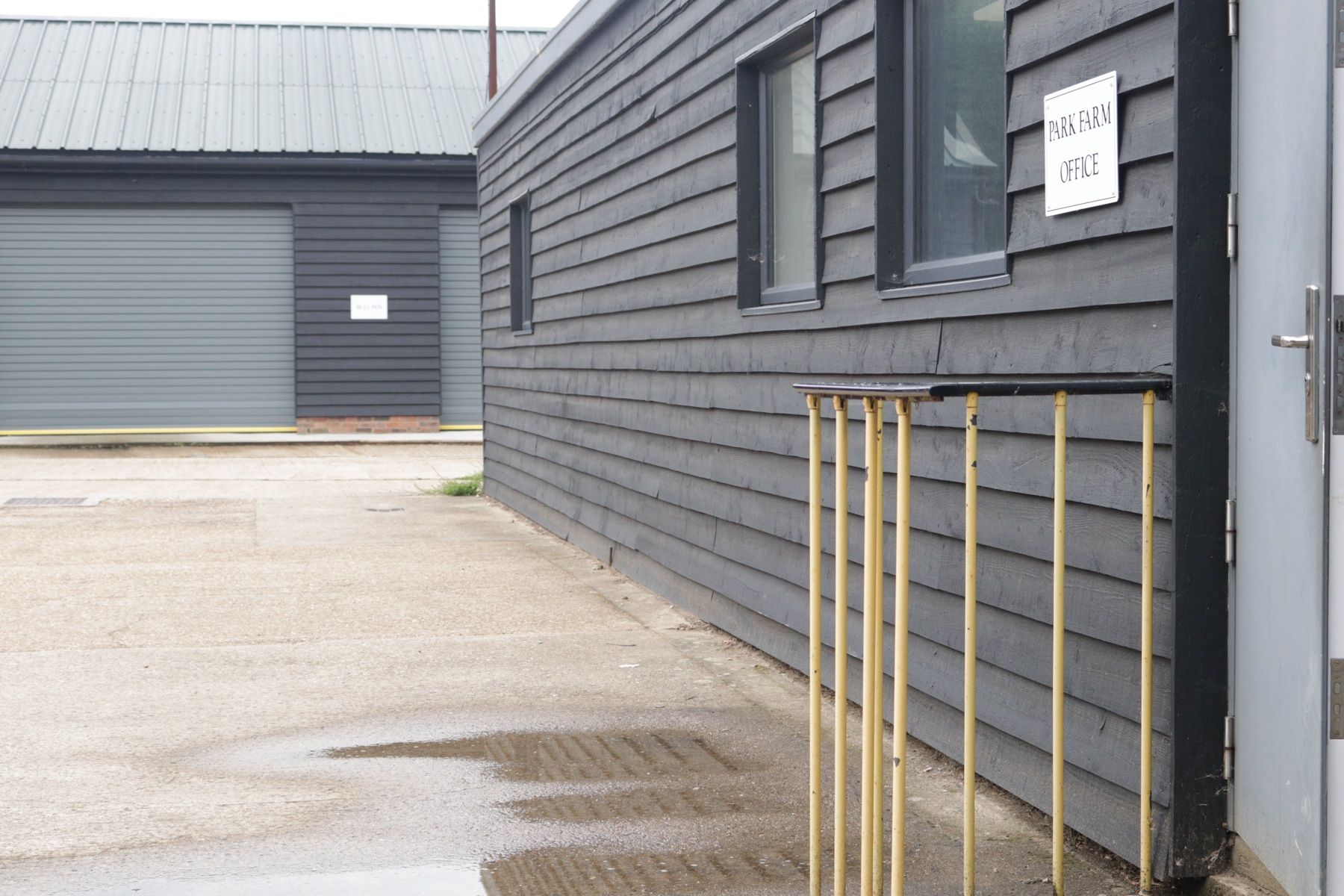 A row of Brim chargers along a workplace car park
