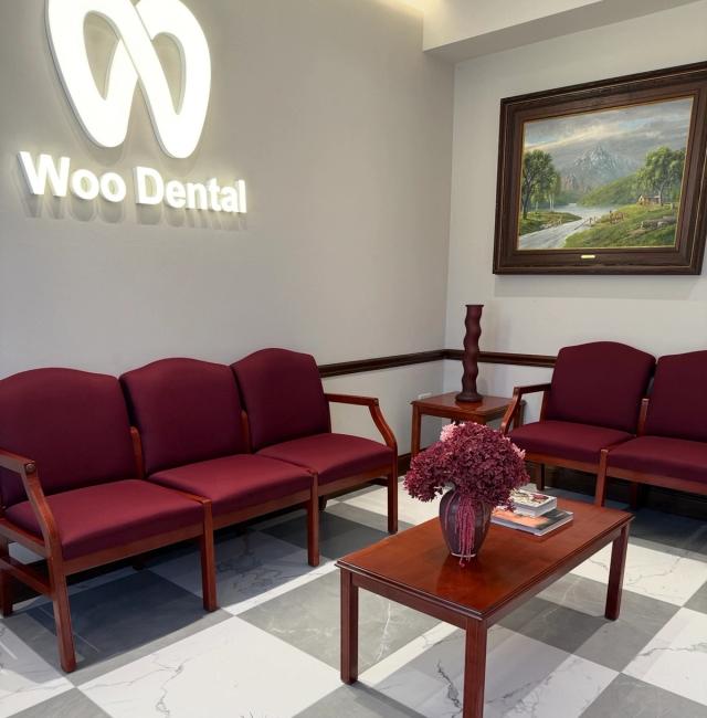 a dental office in Ridgefield, NJ, with a red counter and a sign that says Woo Dental