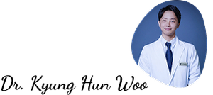 a man in a white coat and tie is smiling for the camera