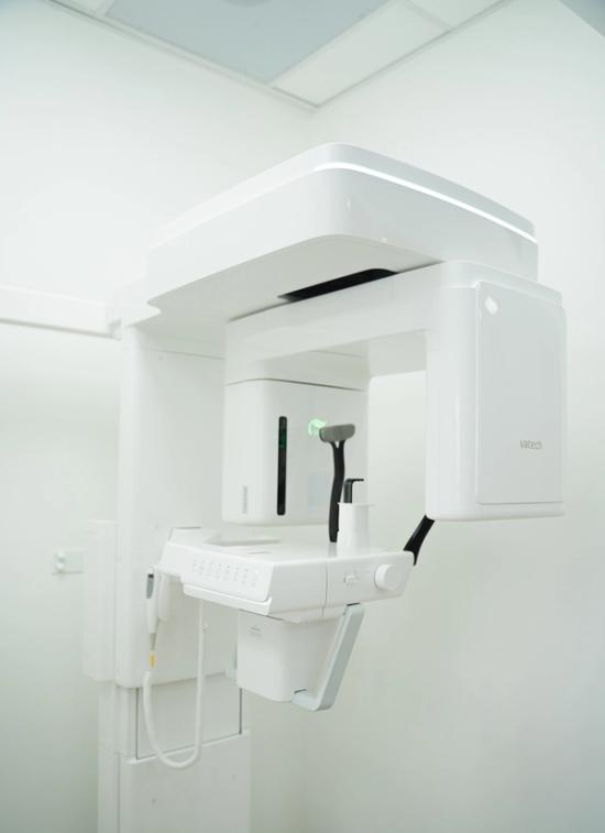 White Vatech panoramic dental X-ray machine.