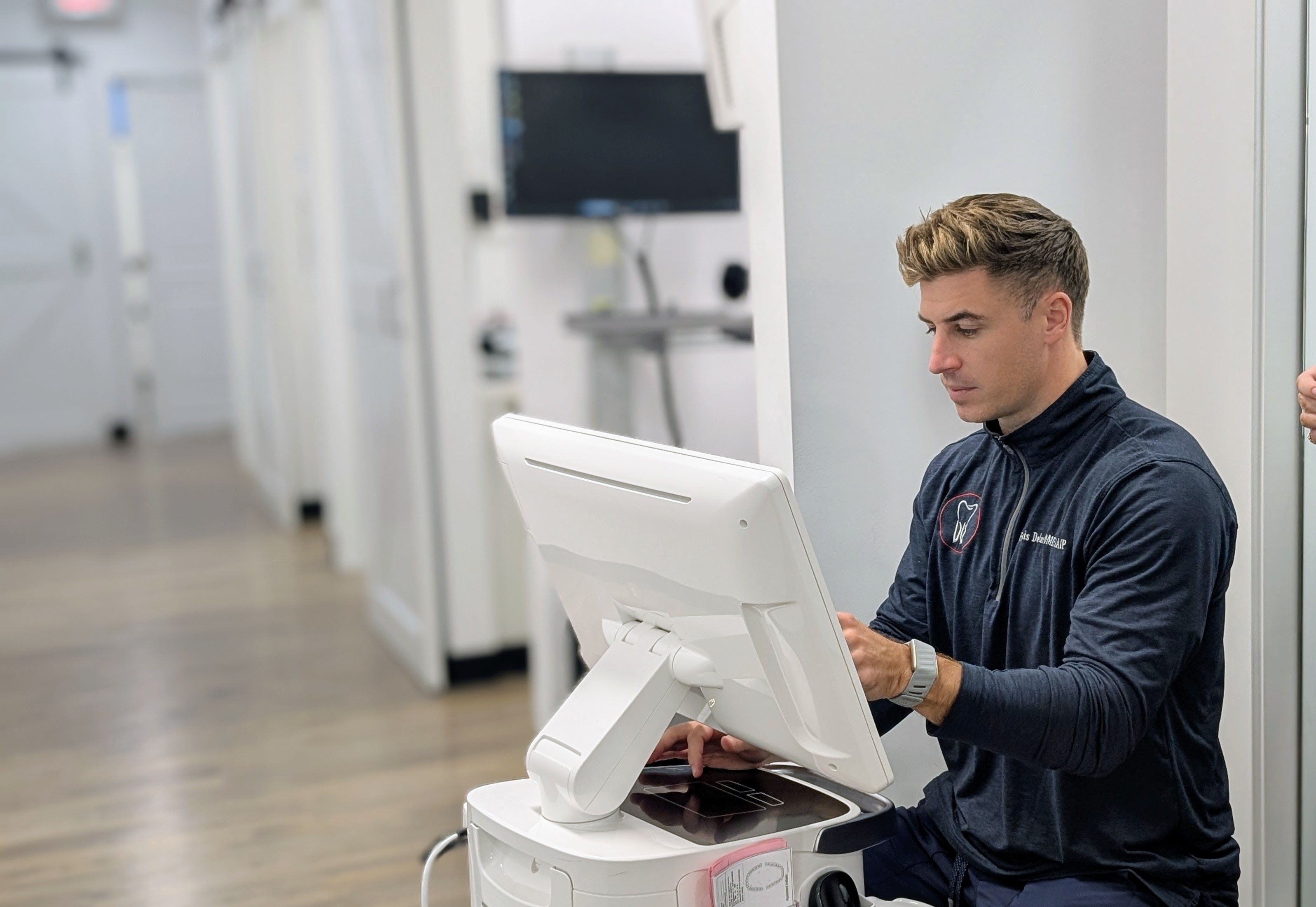 a very cluttered office with two desks and two chairs .