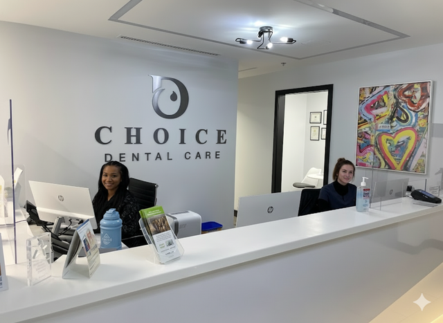 two women sitting at a choice dental care reception desk