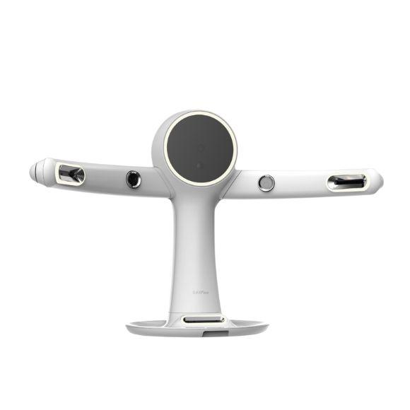 A white, T-shaped modern device with a dark circular screen, two horizontal arms with lighted openings, and a wide flat base.