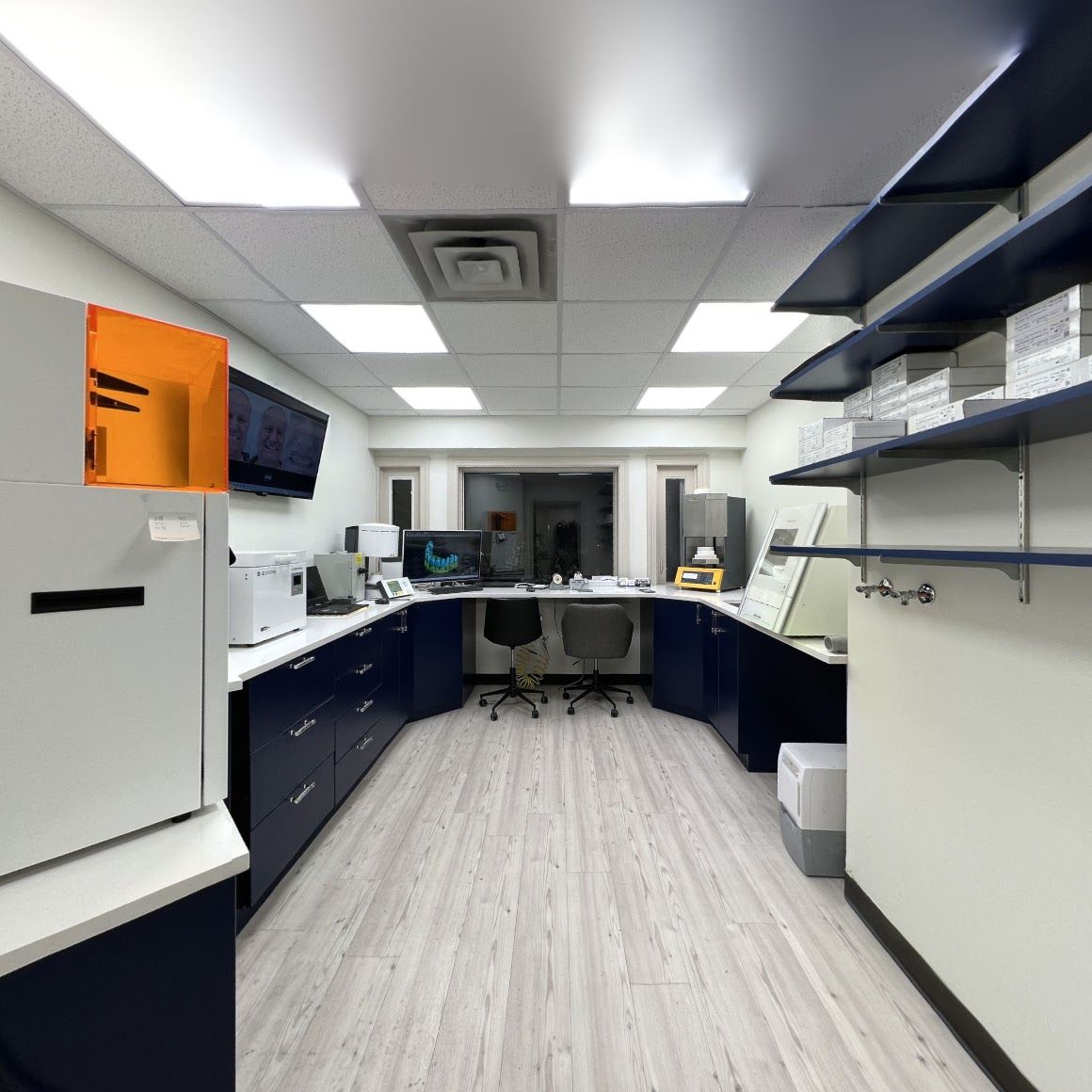 a row of shelves in a room with boxes on them