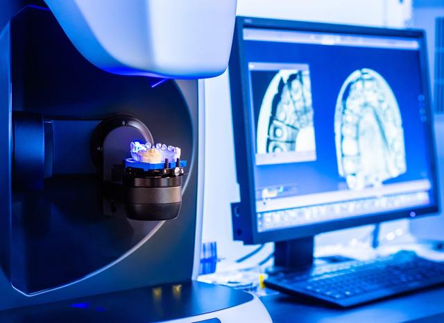 a computer monitor is displaying a picture of a dental model .