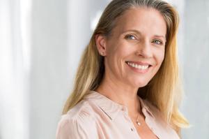 A smiling woman with blonde hair.