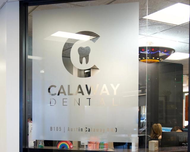 Calaway Dental frosted glass door with 'C' and tooth logo.