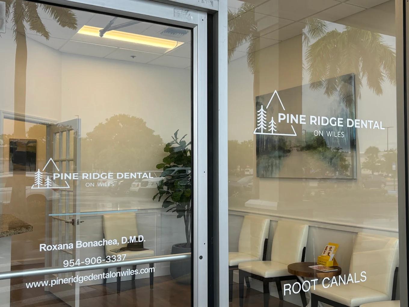 pine ridge dental on wiles has a waiting room with chairs and a table .