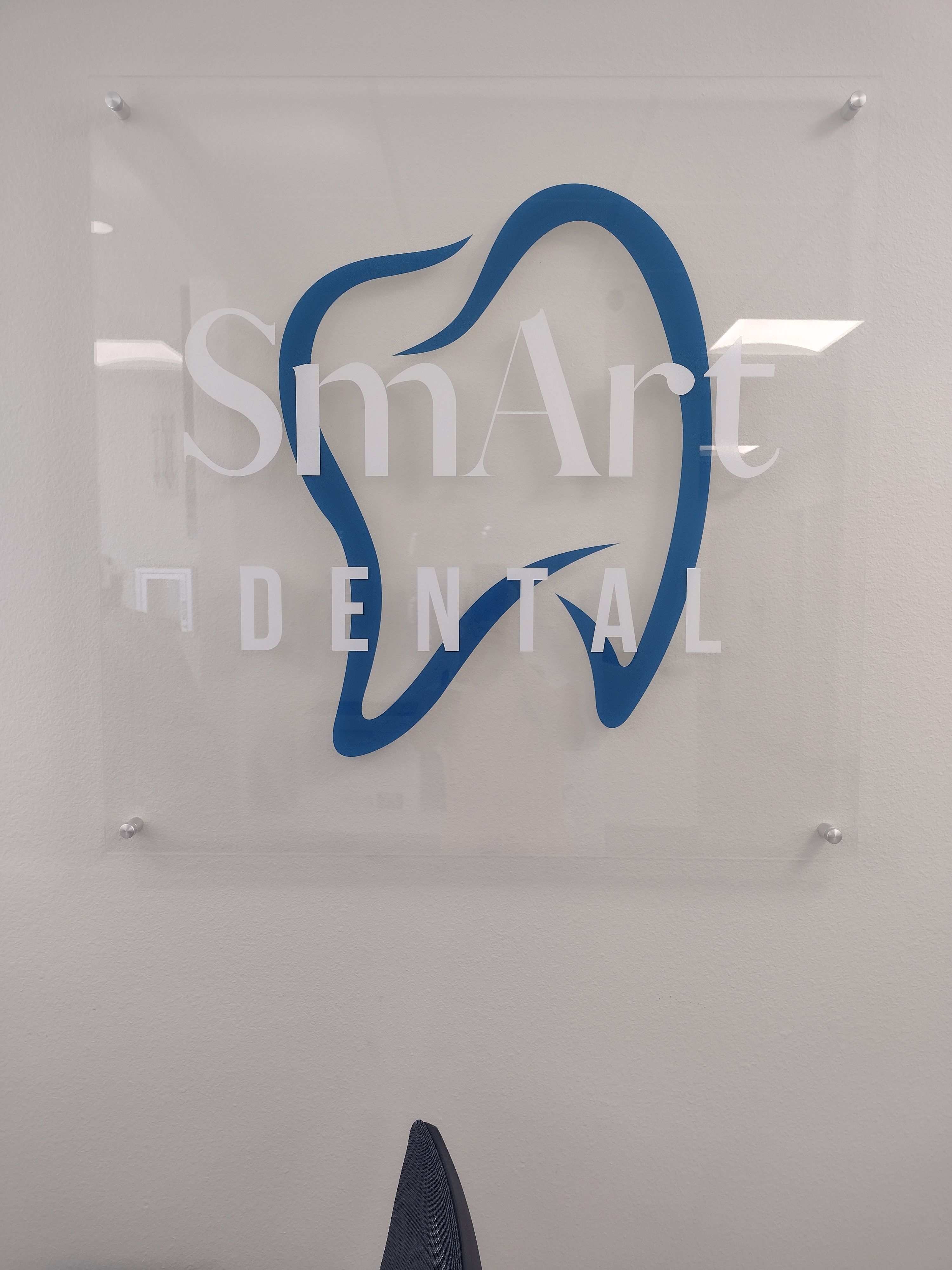 a smart dental sign with a blue tooth on it