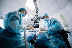 two surgeons are working on a patient in an operating room