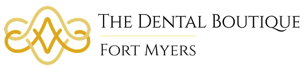 Golden interwoven pattern with two parallel horizontal lines on a black background.