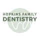 a logo for hopkins family dentistry with a green background