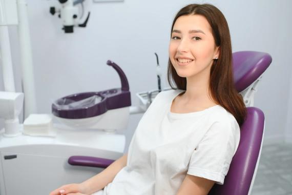 Young woman smiling in a dental chair.