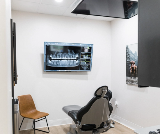 a dental office with an x-ray on the wall
