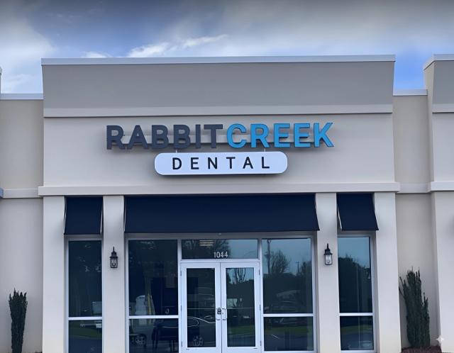 a group of dental assistants are posing for a picture together .