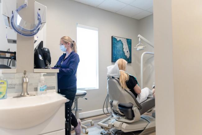 a close up of a model of teeth with a clear brace on it .