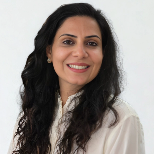 a woman with long dark hair is smiling for the camera