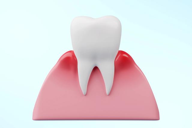 a 3d model of a tooth with a red gums .