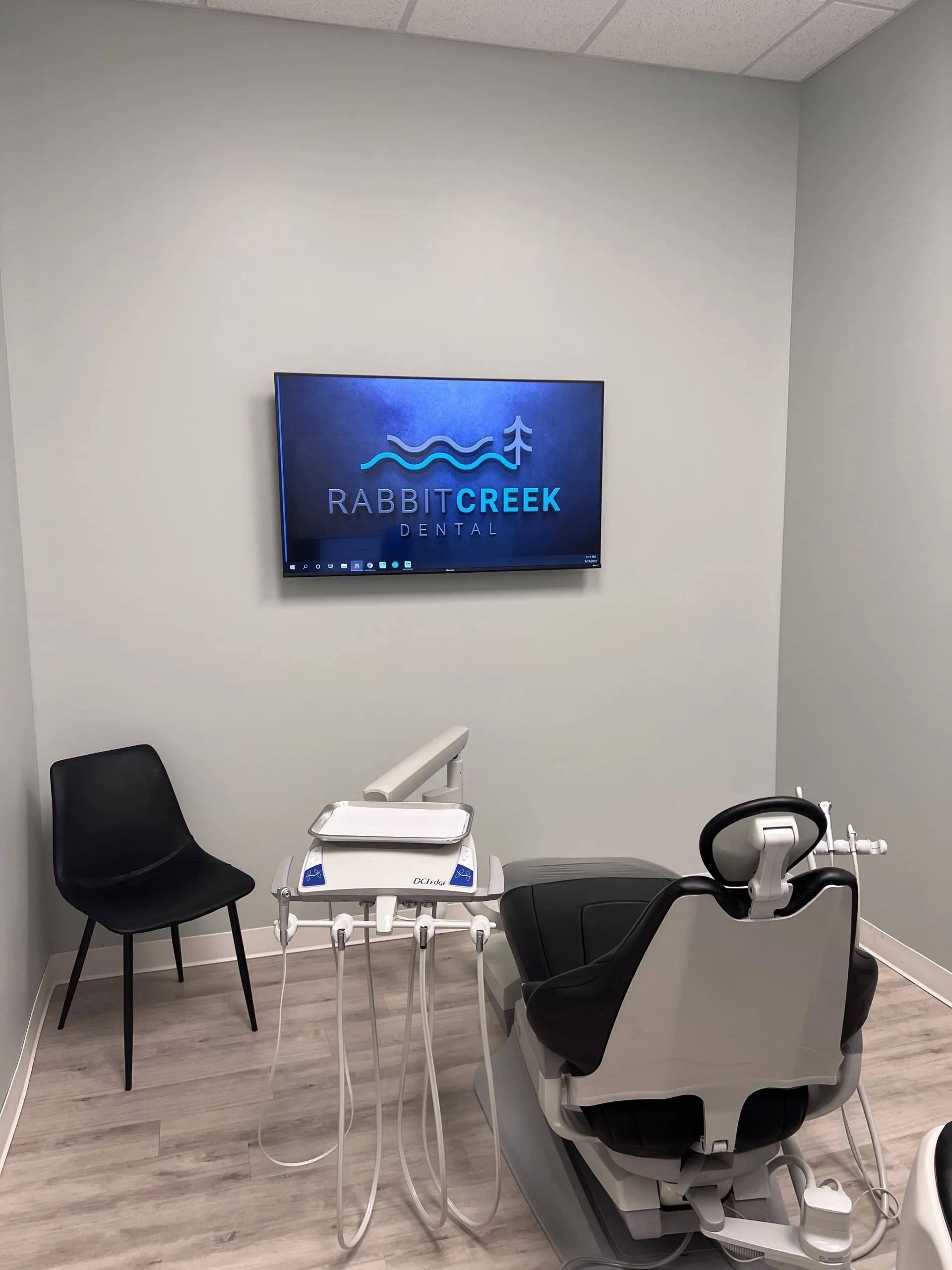 a dental office with a rabbit creek dental logo on the wall